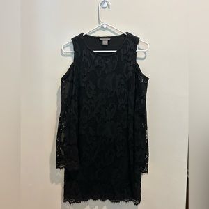Black long sleeve cocktail dress with shoulders exposed. Lace detail.